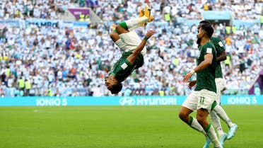 Saudi Arabia's Salem al-Dawsari celebrates scoring their second goal with teammates in a World Cup match against Argentina on November 22, 2022. (Reuters)