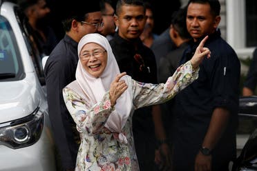 Wan Azizah, wife of Malaysian new Prime Minister Anwar Ibrahim, gestures outside their house in Kajang, Malaysia, on November 24, 2022. (Reuters)