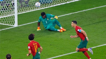 Portugal’s forward #07 Cristiano Ronaldo (R) celebrates after scoring his team’s first goal from the penalty spot past Ghana’s goalkeeper #01 Lawrence Ati Zigi during the Qatar 2022 World Cup Group H football match between Portugal and Ghana at Stadium 974 in Doha on November 24, 2022. (AFP)