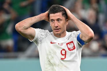 Poland's No.09 striker Robert Lewandowski reacts during the World Cup Group C Qatar 2022 football match between Mexico and Poland at 974 Stadium in Doha.  (AFP)