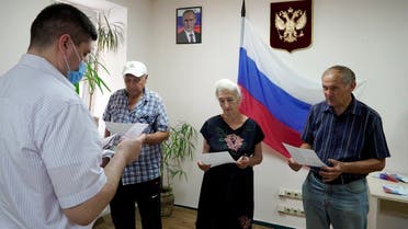 Residents receive Russian passports in Kherson on July 21, 2022, amid the ongoing Russian military action in Ukraine. (AFP)
