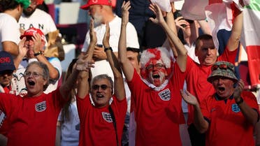 England fans cheer their team on ahead of the Qatar 2022 World Cup Group B football match between England and Iran at the Khalifa International Stadium in Doha on November 21, 2022. (AFP)