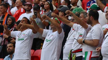 Supporters of Iran react to their national anthem during the Qatar 2022 World Cup Group B football match between Wales and Iran at the Ahmad Bin Ali Stadium in Al-Rayyan, west of Doha on November 25, 2022. (AFP)