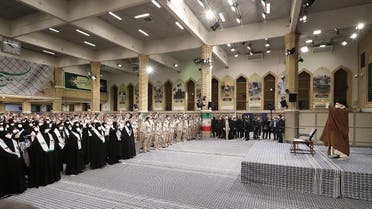 A handout picture provided by the office of Iran’s Supreme Leader Ali Khamenei, shows him saluting a crowd of Basij volunteers loyal to the Islamic republic, before addressing them in the capital Tehran, on November 26, 2022. (Khamenei.ir/AFP)