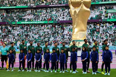 Saudi Arabia players line up during their national anthem ahead of the Qatar 2022 World Cup Group C football match between Poland and Saudi Arabia at the Education City Stadium in Al-Rayyan, west of Doha on November 26, 2022. (AFP)
