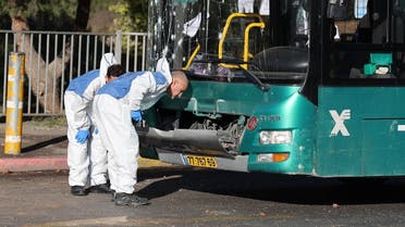 Israeli forensic experts work at the scene of an explosion at a bus stop in Jerusalem on November 23, 2022. (AFP)