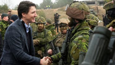 Canadian Prime Minister Justin Trudeau visits members of the Canadian troops, following the Russian invasion of Ukraine, in the Adazi military base, Latvia, on March 8, 2022. (Reuters)