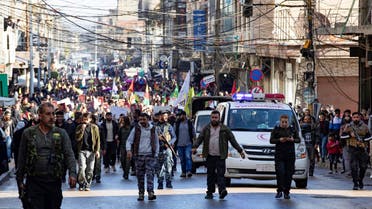 Syrian-Kurdish demonstrators take to the streets to protest against Turkey's threats against their region, in the northeastern Syrian Kurdish-majority city of Qamishli, on November 27, 2022. (AFP)