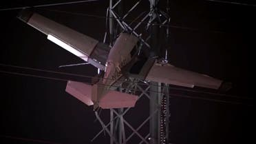 A sdmall plane crashes into high-voltage power lines about 30 miles north of Washington, D.C., causing mass outages, with rescue services working into the night to rescue two people on board the aircraft still entangled in the cables. (Screengrab)