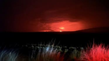 Mauna Loa’s summit region glows during an eruption as viewed by a geologist of the Hawaiian Volcano Observatory in Hawaii, US, on November 28, 2022. (Reuters)