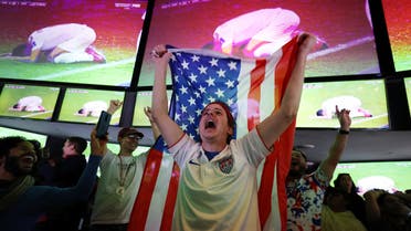 A United States fan celebrates after the match as United States qualify for the knockout stages. (Reuters)