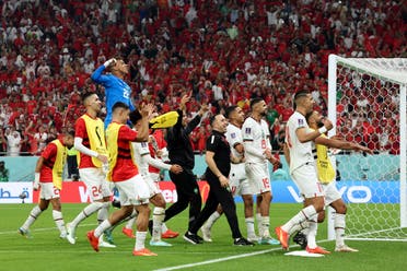 Morocco’s players celebrate winning the Qatar 2022 World Cup Group F football match between Canada and Morocco at the Al-Thumama Stadium in Doha on December 1, 2022. (AFP)