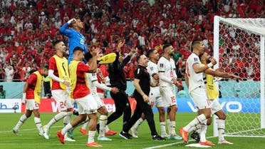 Morocco’s players celebrate winning the Qatar 2022 World Cup Group F football match between Canada and Morocco at the Al-Thumama Stadium in Doha on December 1, 2022. (AFP)