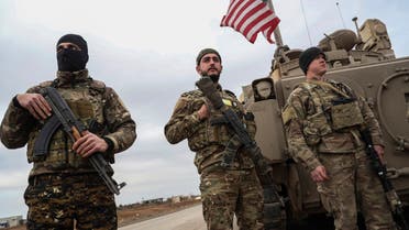 Syrian Democratic forces and American soldiers stand near prison that was attacked by ISIS in Syria, Feb. 8, 2022. (AP)