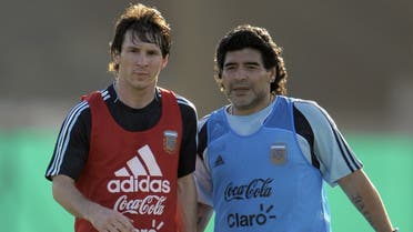 Argentina’s football team coach Diego Maradona speaks with forward Lionel Messi (L) during a training session in Ezeiza, Buenos Aires on March 24, 2009. (AFP)