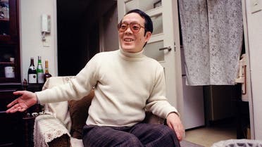 This file photo taken on February 5, 1992 shows former Japanese student Issei Sagawa, known as the “Kobe Cannibal” for killing and then devouring a Dutch student in 1981, smiling and gesturing as he meets with an AFP journalist at his apartment in Yokohama. (AFP)
