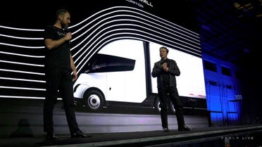 Tesla Chief Executive Elon Musk speaks with Dan Priestly, Senior Manager of Tesla Semi Truck Engineering, during the live-streamed unveiling of the Tesla Semi electric truck, in Nevada, U.S. December 1, 2022, in this still image taken from video. (Reuters)