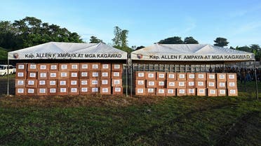 This photo shows coffins with the unclaimed bodies of 70 prisoners before a mass burial at New Bilibid Prison Cemetery in Muntinlupa, metro Manila on December 2, 2022. (AFP)