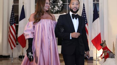 Chrissy Teigen and John Legend arrive for a state dinner in honor of French President Emmanuel Macron at the White House in Washington, U.S., December 1, 2022. (Reuters)