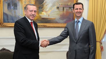 A handout picture released by the Syrian Arab News Agency (SANA) shows Syrian President Bashar al-Assad (R) shaking hands with Turkish Prime Minister Recep Tayyip Erdogan during a meeting in Aleppo, some 350 kms north of Damascus, on February 6, 2011. (AFP)