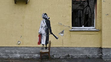 This file photograph taken on November 16, 2022 shows a graffiti made by Banksy on the wall of a destroyed building in the town of Gostomel, near Kyiv, amid the Russian invasion of Ukraine. (AFP)