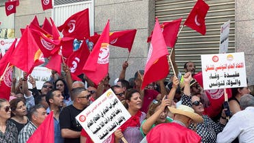 Supporters of the Tunisian General Labour Union (UGTT), carry flags as they gather during a national public strike called by the union, outside their headquarters in Tunis, Tunisia June 16, 2022. REUTERS/Jihed Abidellaoui