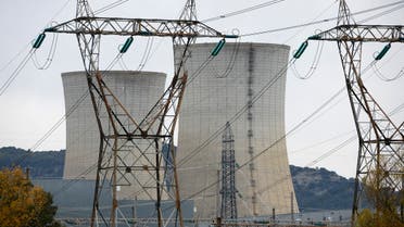 Electrical power pylons of high-tension electricity power lines are seen in front the cooling towers of the Tricastin nuclear power plant site in Saint-Paul-Trois-Chateaux, France, November 21, 2022. (Reuters)