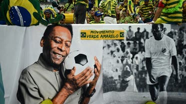 Ronaldo and Pele of Brazil signed Brazilian shirts on display for