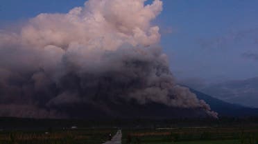 Mount Semeru spews smoke and ash in Lumajang on December 4, 2022. (Photo by Agus Harianto / AFP)