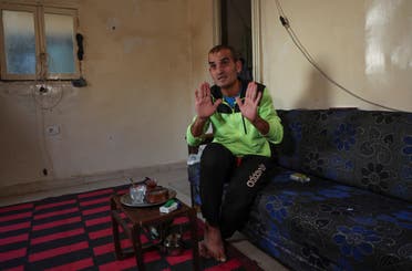 Unemployed Lebanese Hussein Hamadeh gestures as he speaks during an interview with Reuters inside his home in Beirut's southern suburb of Ouzai, Lebanon November 15, 2022 (Reuters)-CRISIS-POVERTY