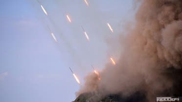 This picture taken on October 6, 2022 and released from North Korea's official Korean Central News Agency (KCNA) on October 10, 2022 shows the North Korean People's Army front-line long-range artillery division and air force squadron during a fire attack training exercise, at an undisclosed location. (AFP)