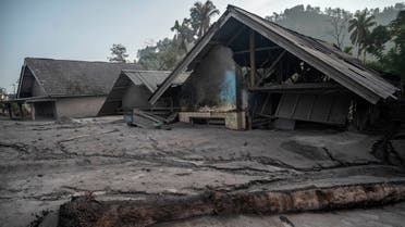 This picture shows damaged houses inundated by mud following a volcanic eruption by Mount Semeru at Kajar Kuning village in Lumajang on December 5, 2022. (AFP)