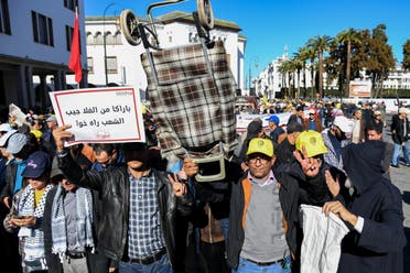 Demonstrators take part in a march called by the Moroccan Social Front (FSM) coalition to protest soaring prices, political repression, and social oppression, in the capital Rabat, on December 4, 2022. (AFP)