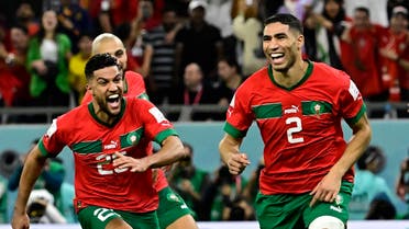 Morocco’s defender #02 Achraf Hakimi (R) celebrates with teammates after converting the last penalty during the penalty shoot-out to win the Qatar 2022 World Cup round of 16 football match between Morocco and Spain at the Education City Stadium in Al-Rayyan, west of Doha on December 6, 2022. (AFP)