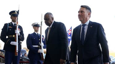 U.S. Defense Secretary Lloyd Austin escorts Australian Defense Minister Richard Marles into the Pentagon for their meeting in Washington, U.S., December 5, 2022. REUTERS/Kevin Lamarque