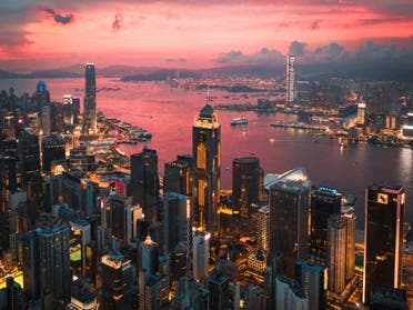 Cityscape of the Victoria Harbor region of Hong Kong during sunset. (Unsplash, Manson Yim)