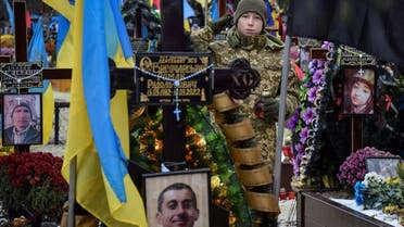 A military cadet visits graves of Ukrainian servicemen who were killed during Russia’s attack of Ukraine, on the Day of Ukrainian Army at the Lychakiv cemetery in Lviv, Ukraine December 6, 2022. (Reuters)