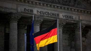 FILE PHOTO: The German national flag flies in front of the Reichstag building, the seat of the lower house of the parliament Bundestag, in Berlin, Germany, April 5, 2022. REUTERS/Lisi Niesner/File Photo