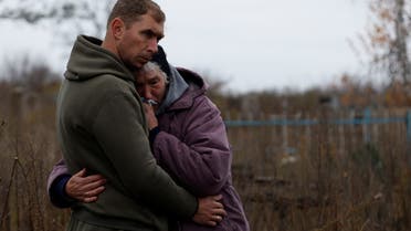 Mykola Melenets, 37, comforts his mother Nina Melenets, 62, as the coffin of his brother and her son, Oleksandr Melenets, 44, who his family says was killed in shelling, is lowered into a grave in the village of Kamyanka, on the outskirts of Izium, Kharkiv region, Ukraine, November 3, 2022. Nina is still looking for her husband, Serhiy, who has been missing since late March. It will be easier for our hearts if they match the DNA, she said. We spent 44 years together. We spent our whole lives together. (Reuters)