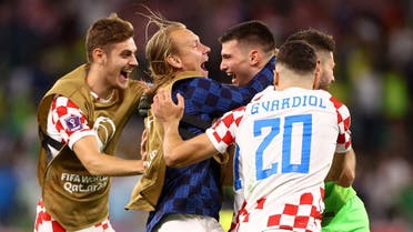 Croatia’s Dominik Livakovic celebrates with teammates after winning the penalty shootout and qualifying for the semifinal. (Reuters)