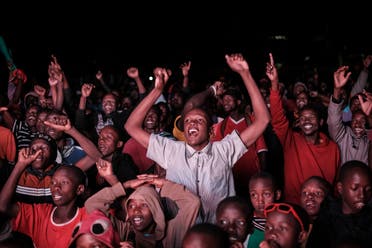 Kenyan football fans celebrate Morocco’s win at Kibera slum in Nairobi on December 10, 2022. (AFP)