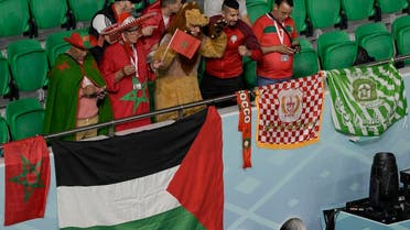 Supporters of Morocco cheer on the stands ahead of the Qatar 2022 World Cup quarterfinal football match between Morocco and Portugal at the Al-Thumama Stadium in Doha on December 10, 2022. (AFP)