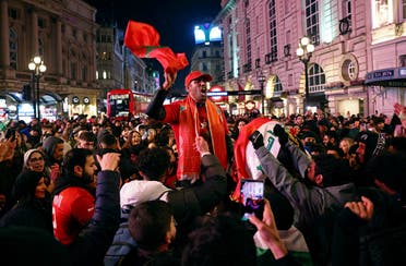 Morocco fans in Piccadilly Circus celebrate after reaching the semifinals. (Reuters)