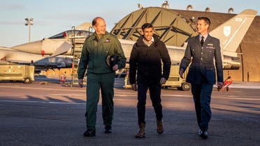 British Prime Minister Rishi Sunak walks with Chief of the Air Staff Sir Mike Wigston and Station Commander of RAF Coningsby, Group Captain Billy Cooper at number 11 (fighter) Squadron during a visit to RAF Coningsby, Lincolnshire, Britain, on December 9, 2022. (Reuters)