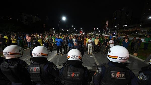 Bolsonaro Supporters Clash With Police, Set Fires In Brazil Capital