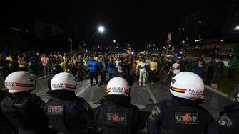Bolsonaro supporters clash with police, set fires in Brazil capital 