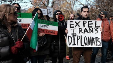 People gather outside of an Iranian diplomat’s residence to denounce the Iranian government and the recent execution of a protester on December 10, 2022 in New York City. (AFP)