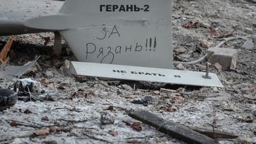 Parts of the drone are seen at the site of a building destroyed by a Russian drone attack, as their attack on Ukraine continues, in Kyiv, Ukraine December 14, 2022. The inscription reads For Ryazan. REUTERS/Gleb Garanich