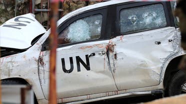 Lebanese soldiers stand behind a damaged UN peacekeeper vehicle at the scene where a UN peacekeeper convoy came under gunfire in the Al-Aqbiya village, south Lebanon, Thursday, Dec. 15, 2022. (AP Photo/Mohammed Zaatari)