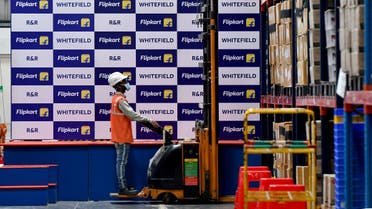 A worker at Flipkart, a leading e-commerce firm in India, store items inside its fulfilment centre on the outskirts of Bengaluru, India. (File photo: Reuters)
